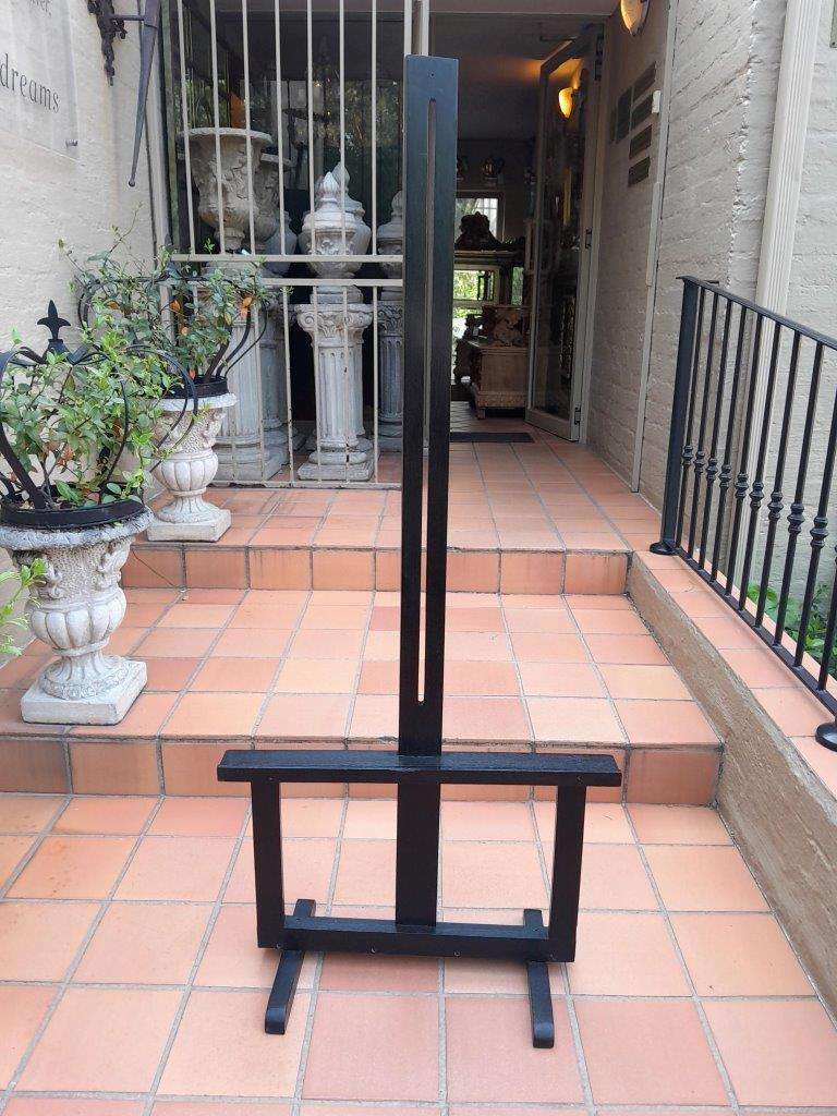 A Decorative Wooden Display Easel In An Ebonized Contemporary Finish