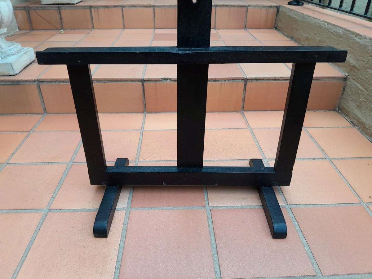 A Decorative Wooden Display Easel In An Ebonized Contemporary Finish