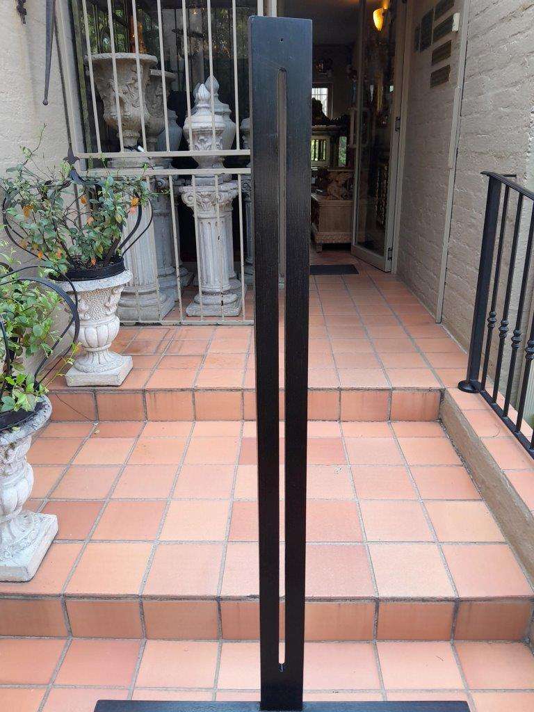 A Decorative Wooden Display Easel In An Ebonized Contemporary Finish