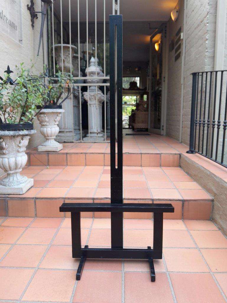 A Decorative Wooden Easel In An Ebonized Contemporary Finish