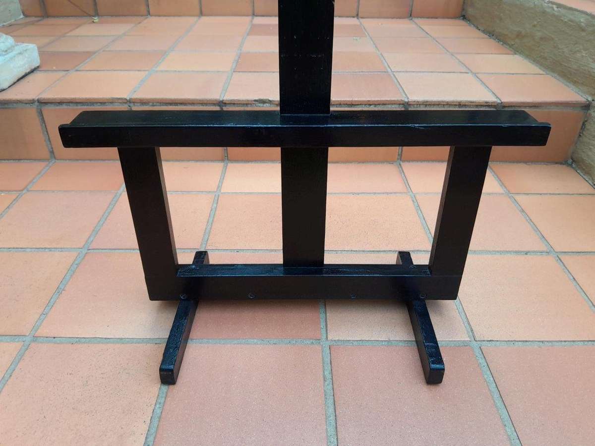 A Decorative Wooden Easel In An Ebonized Contemporary Finish