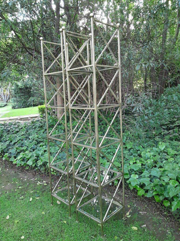 A Pair Of Wrought Iron And Gilded Display Stands With Bevelled Glass Shelves Custom-Made For The ...