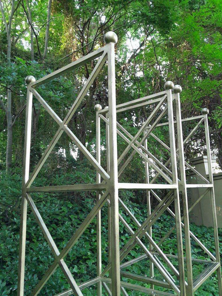 A Pair Of Wrought Iron And Gilded Display Stands With Bevelled Glass Shelves Custom-Made For The ...