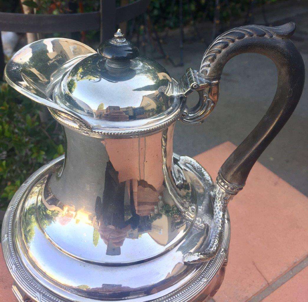 Silver plated tea kettle on stand