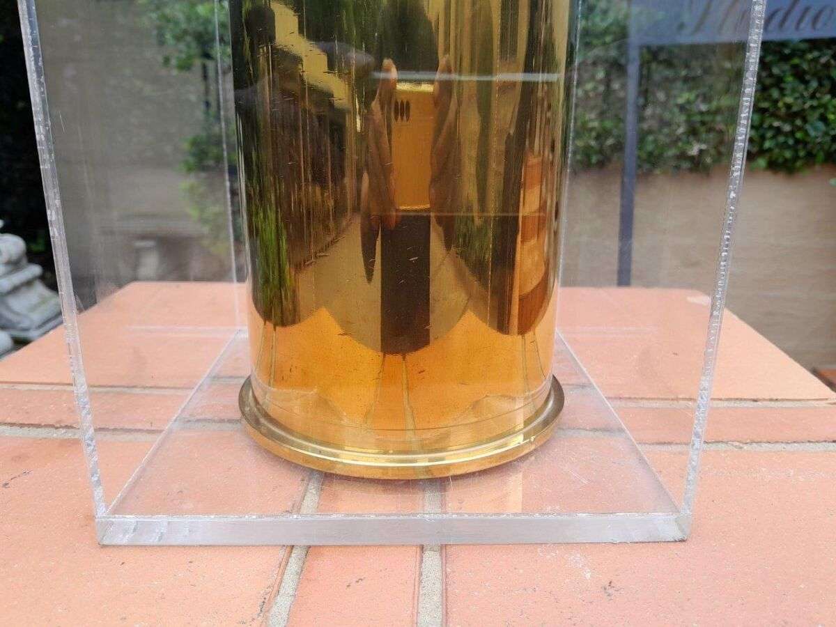 A 20TH Century Brass Cannon Shell In A Custom-Made Display Perspex Box