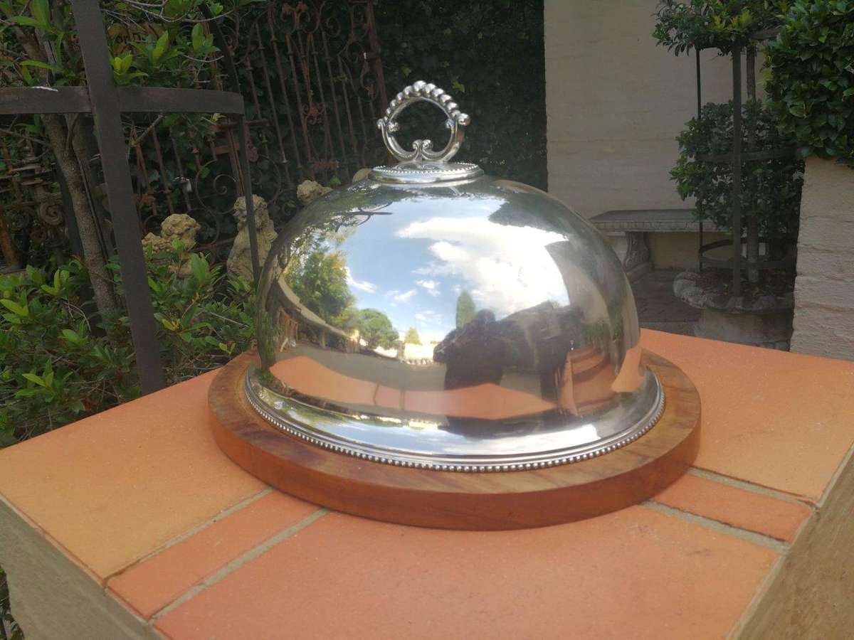 An Epns Food Dome On Wooden Base