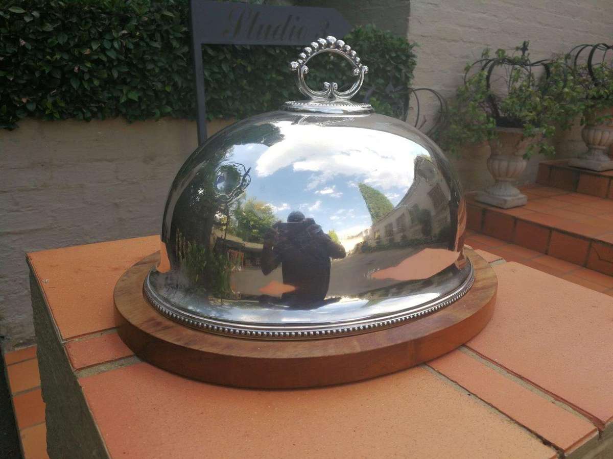 An Epns Food Dome On Wooden Base