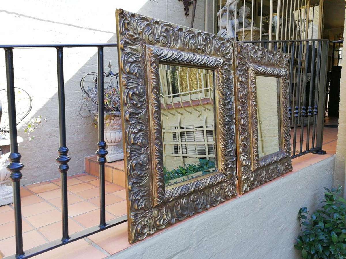A Pair Of  20th Century Bevelled And Gilt-Painted Wooden Mirrors
