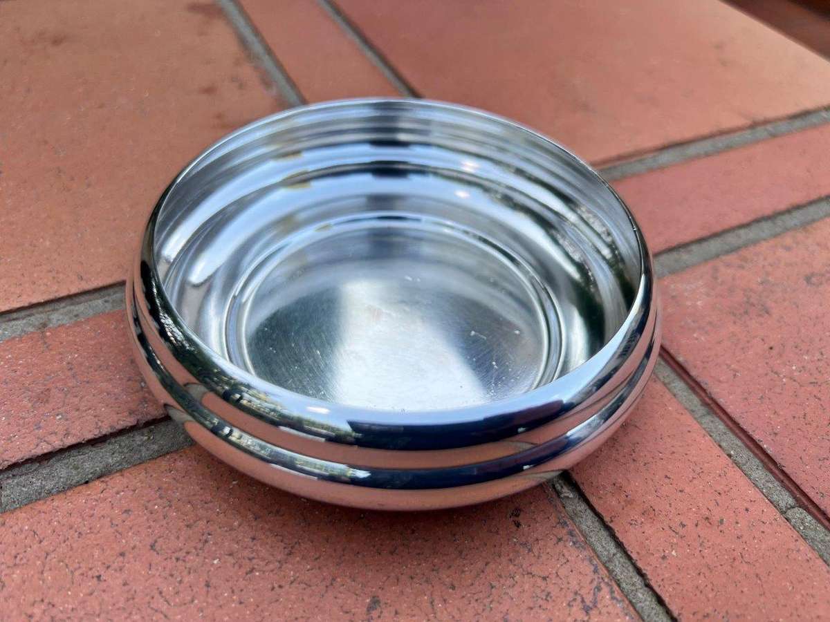 A Christofle Silver Plated Bottle Coaster, And A Silver Plated Ashtray