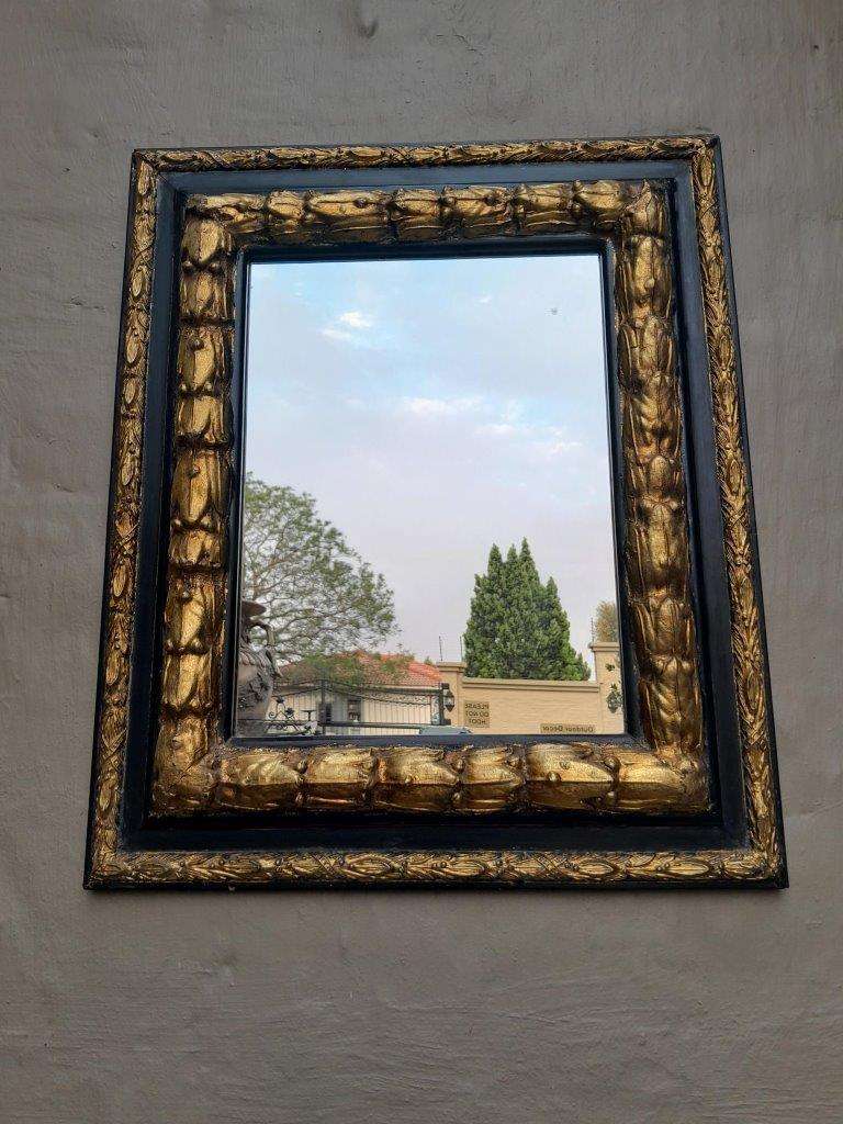 A 20th Century Gilt Painted And Ebonised Mirror