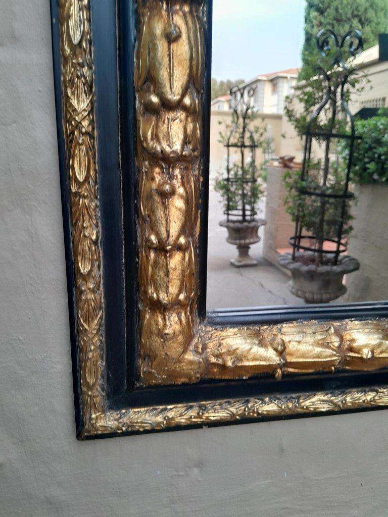 A 20th Century Gilt Painted And Ebonised Mirror