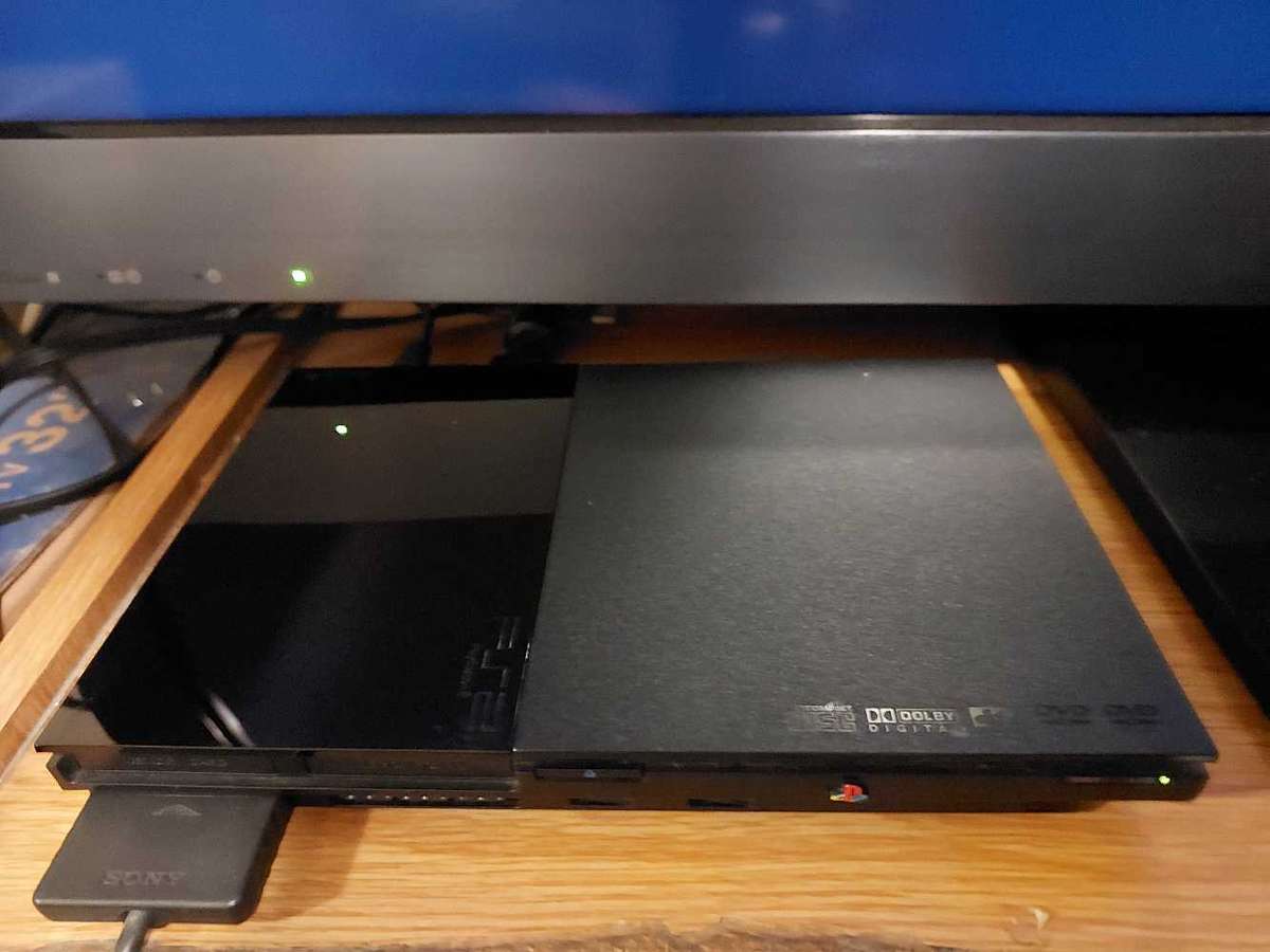 Playstation 2 + x6 Games