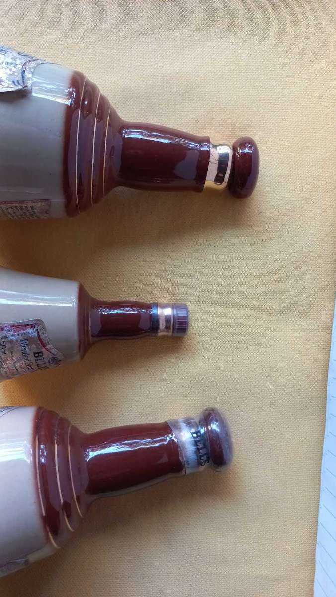 Vintage collectable lot of "Bells Scotch Whisky " bell shaped decanters made by Wade