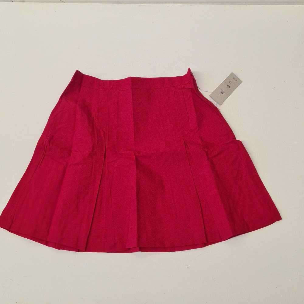 Mid-length girls shirts. School shirts stock