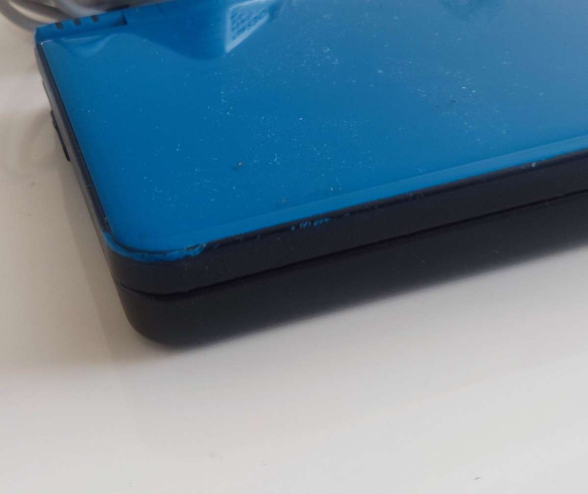 Nintendo Dsi XL console with charger