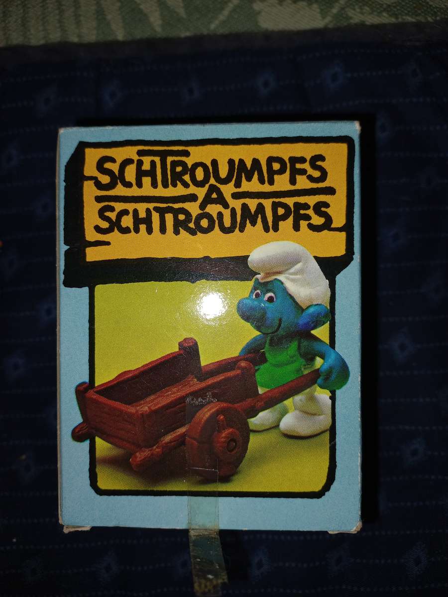 Vintage Smurf with wheelbarrow plus gardener with rake.