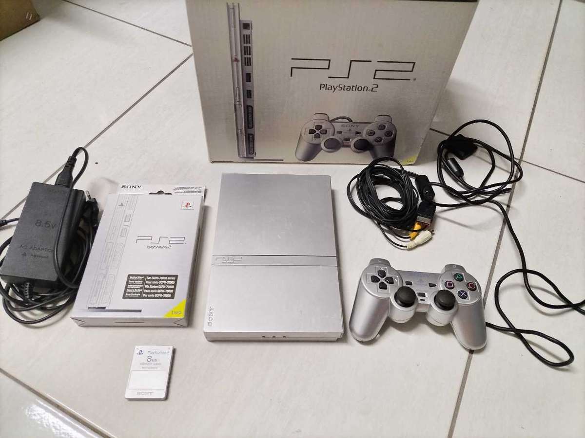 Boxed silver Playstation 2 slim