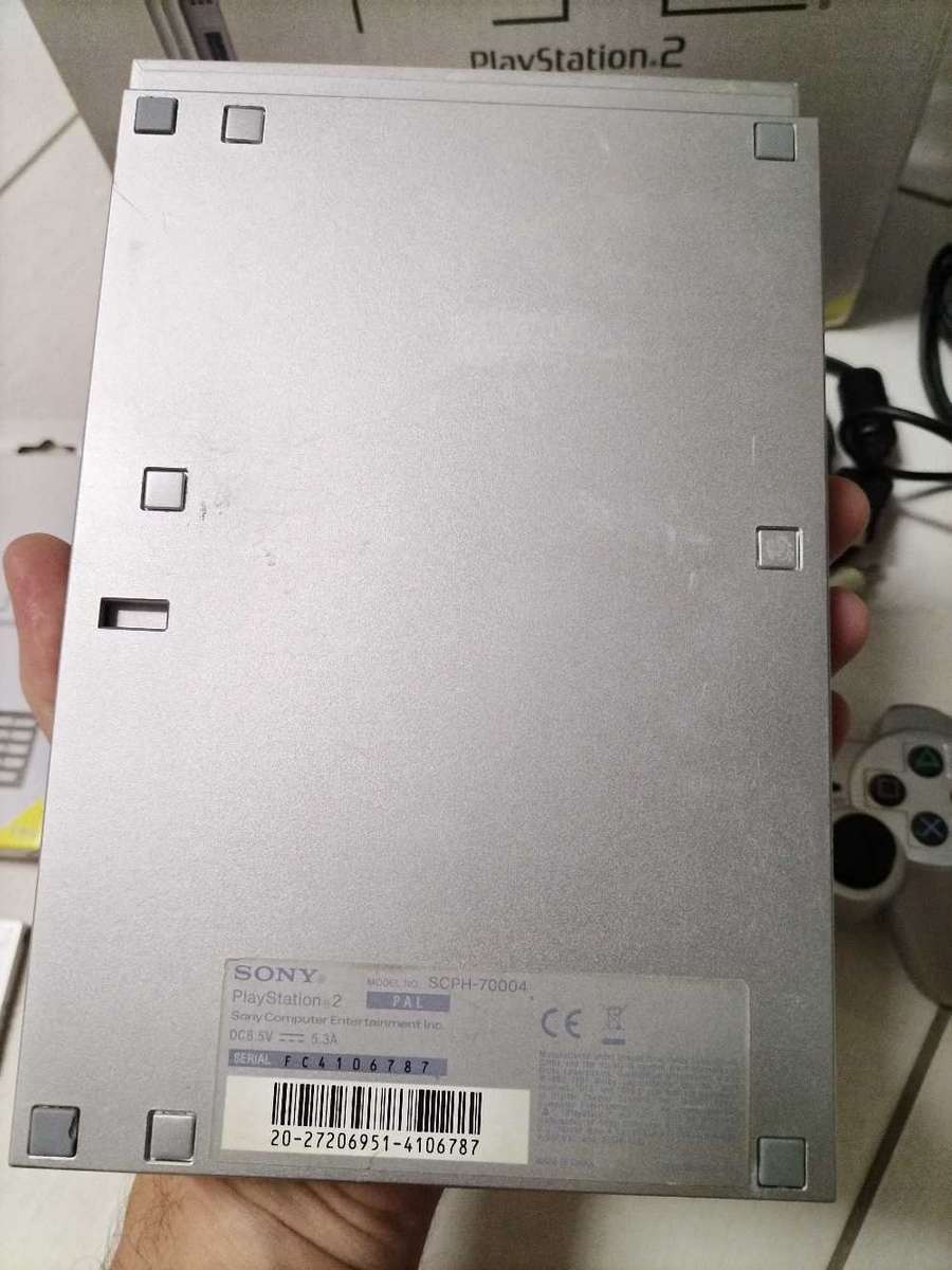 Boxed silver Playstation 2 slim