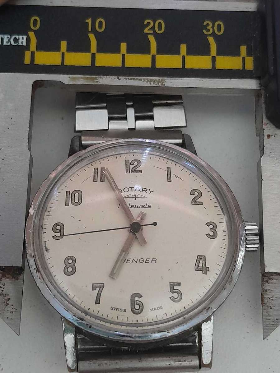 Rotary wind up watch