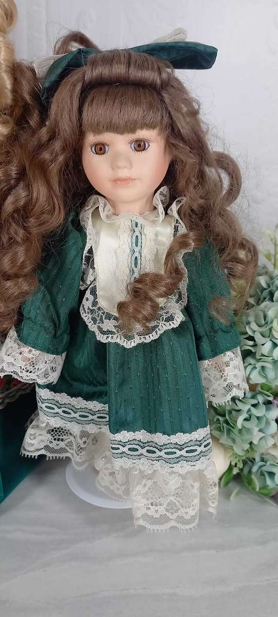 Trio of Porcelain Dolls on stands