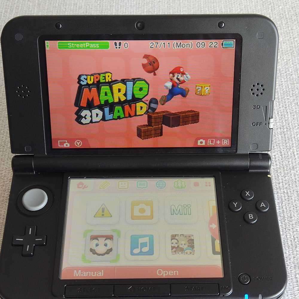 Nintendo 3ds XL console with original charger
