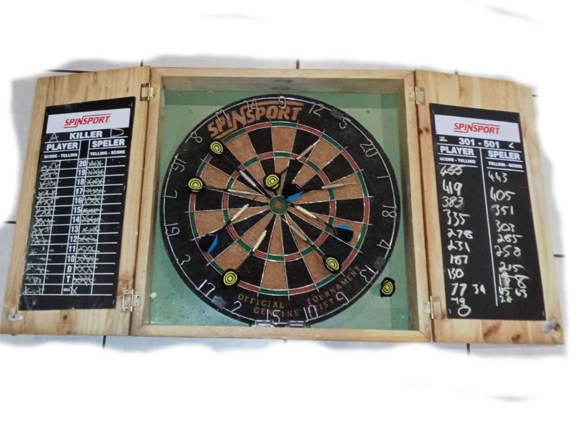 Dartboard in wooden case with darts