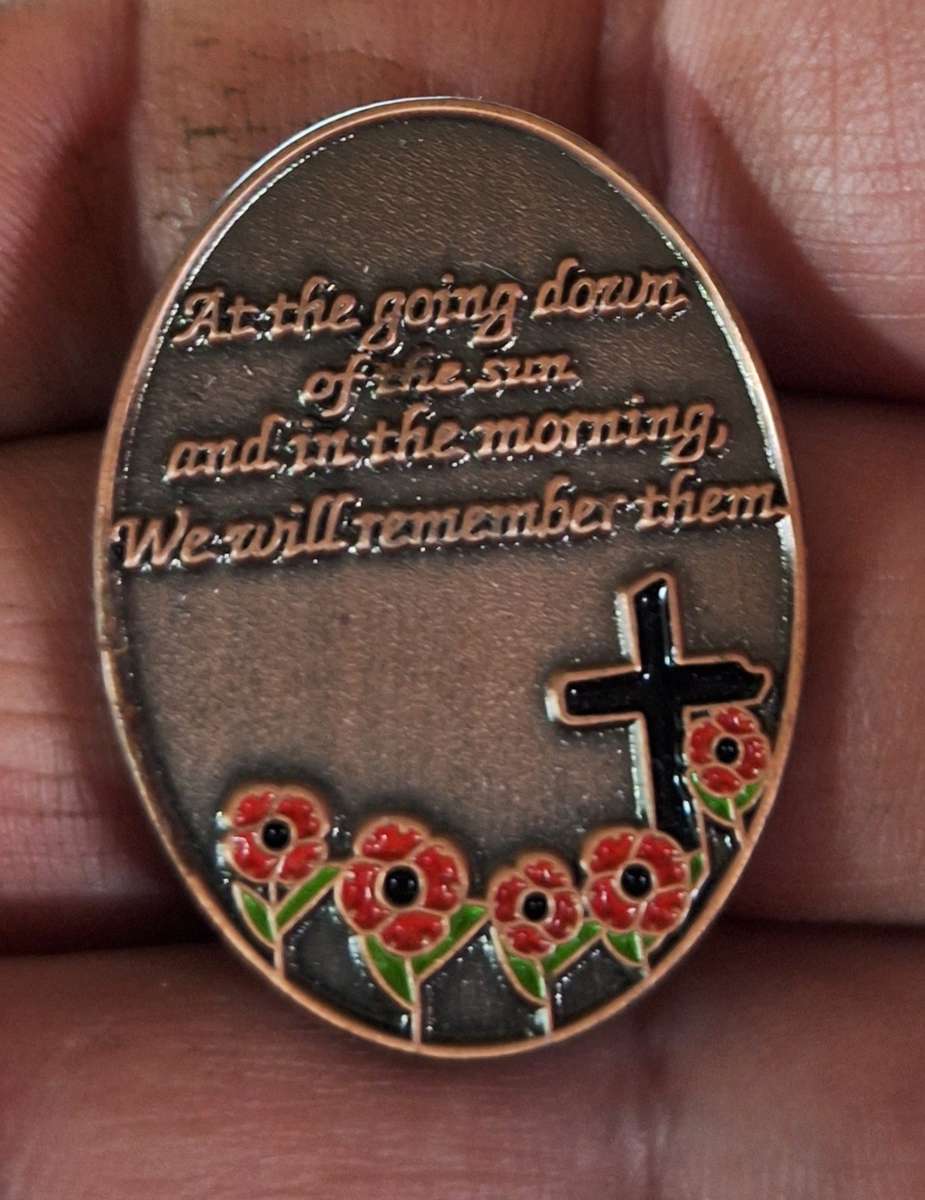 Poppy pin remembrance badge