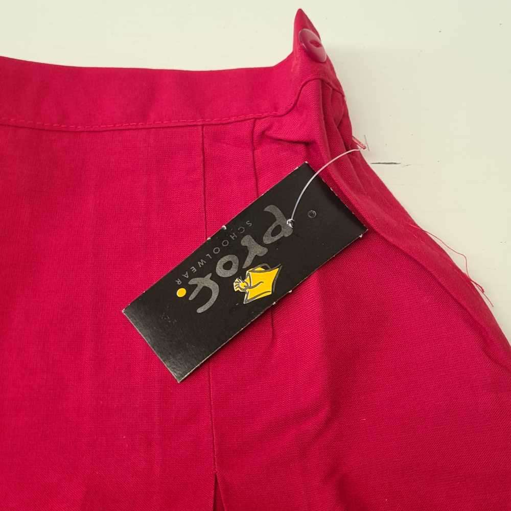 Mid-length girls shirts. School shirts stock