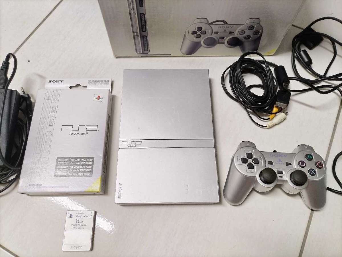 Boxed silver Playstation 2 slim