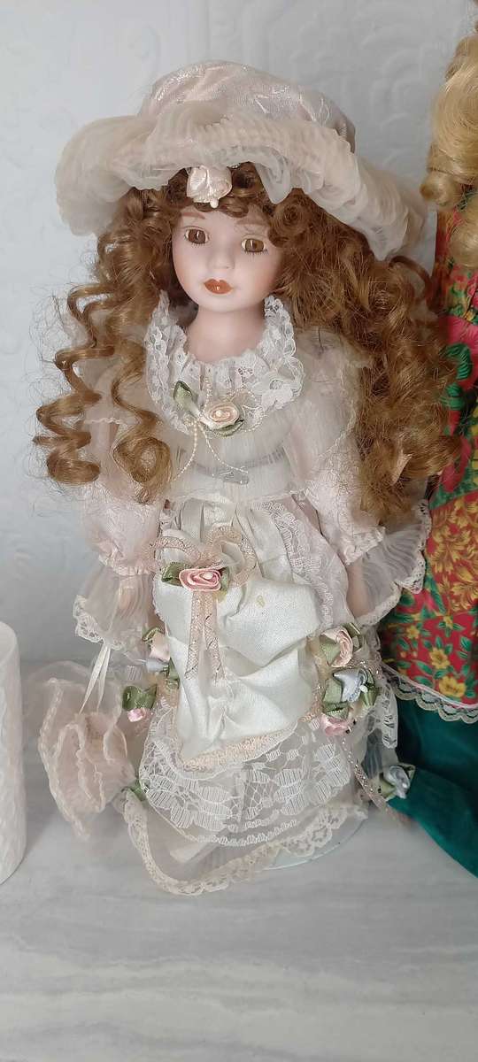 Trio of Porcelain Dolls on stands