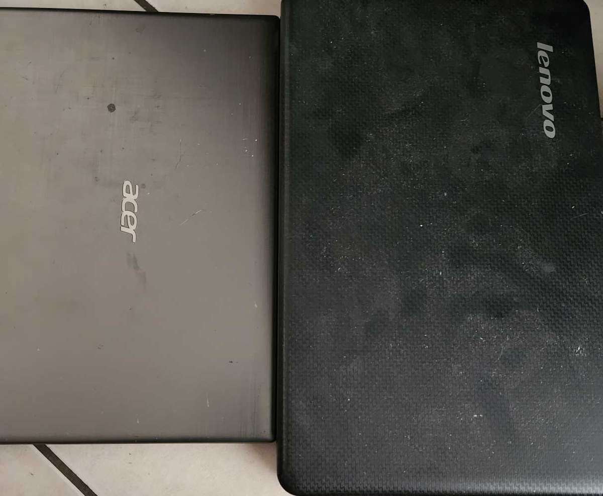 Two laptops for spares or to fix and a free cd writer also not working