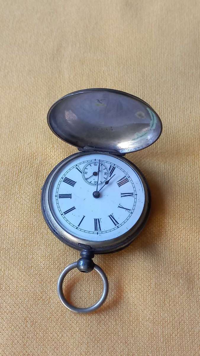 Pocket watch with  silver engraved casing