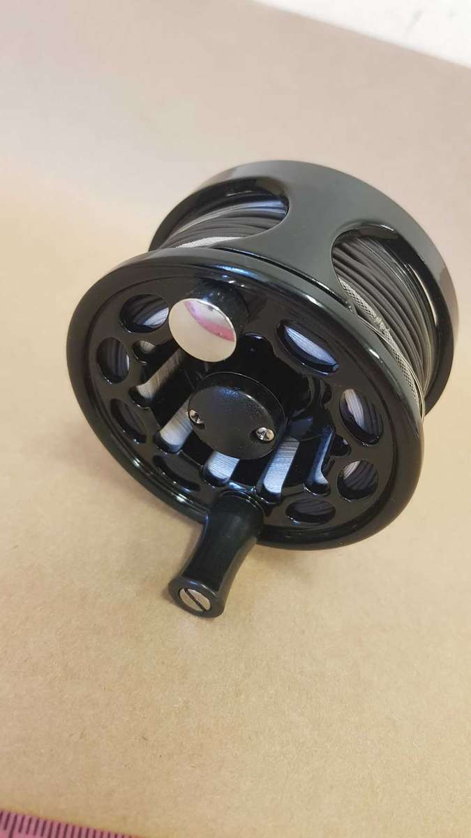 Explorer fly reel loaded with backing, fly line and tippett.