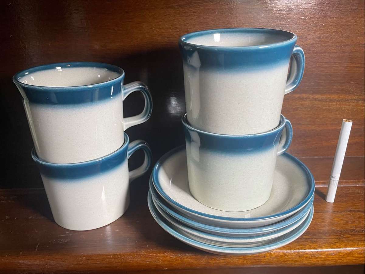 A set of four cups with saucers  - Wedgwood pacific blue pattern