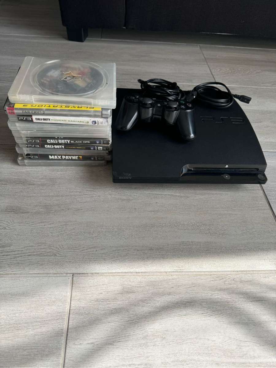PS3 console with controller + 5 free games