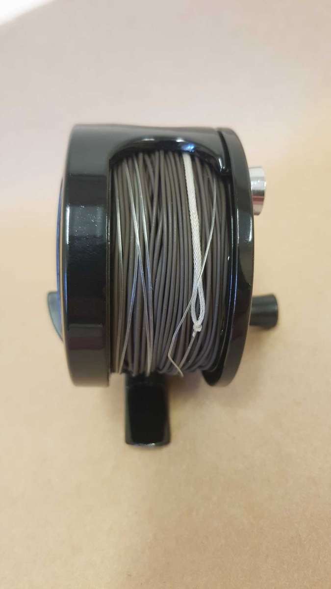Explorer fly reel loaded with backing, fly line and tippett.