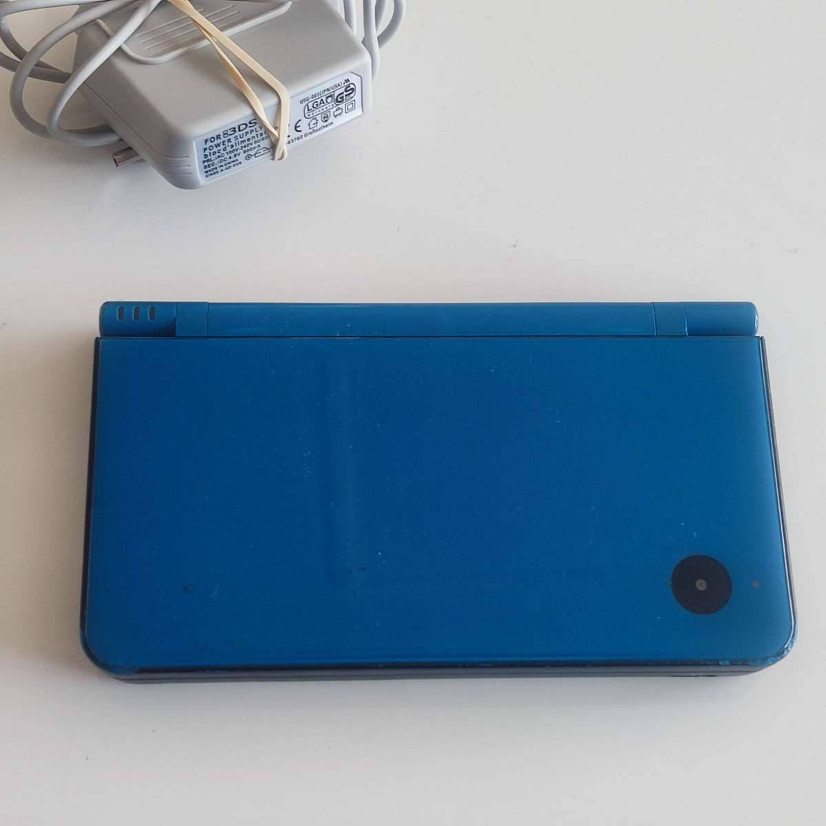 Nintendo Dsi XL console with charger