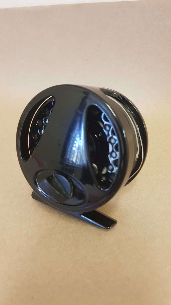 Explorer fly reel loaded with backing, fly line and tippett.