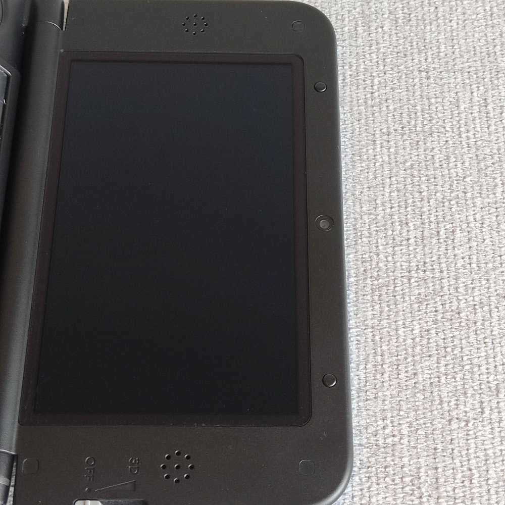 Nintendo 3ds XL console with original charger
