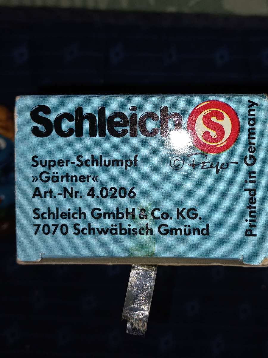 Vintage Smurf with wheelbarrow plus gardener with rake.