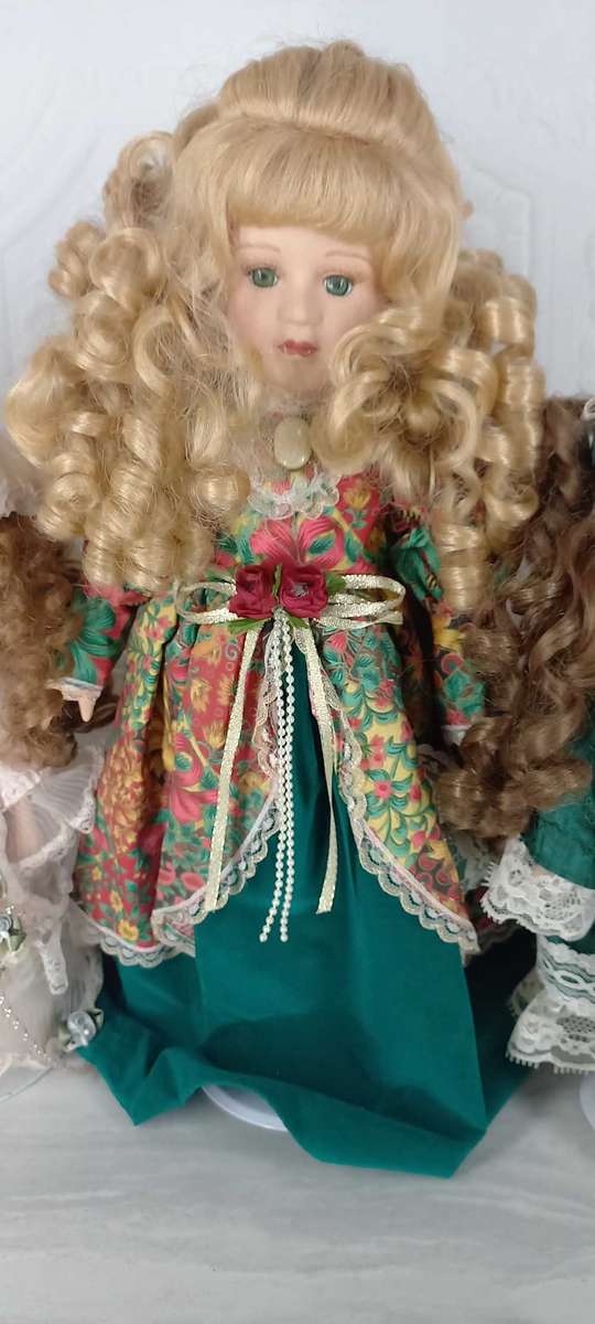 Trio of Porcelain Dolls on stands