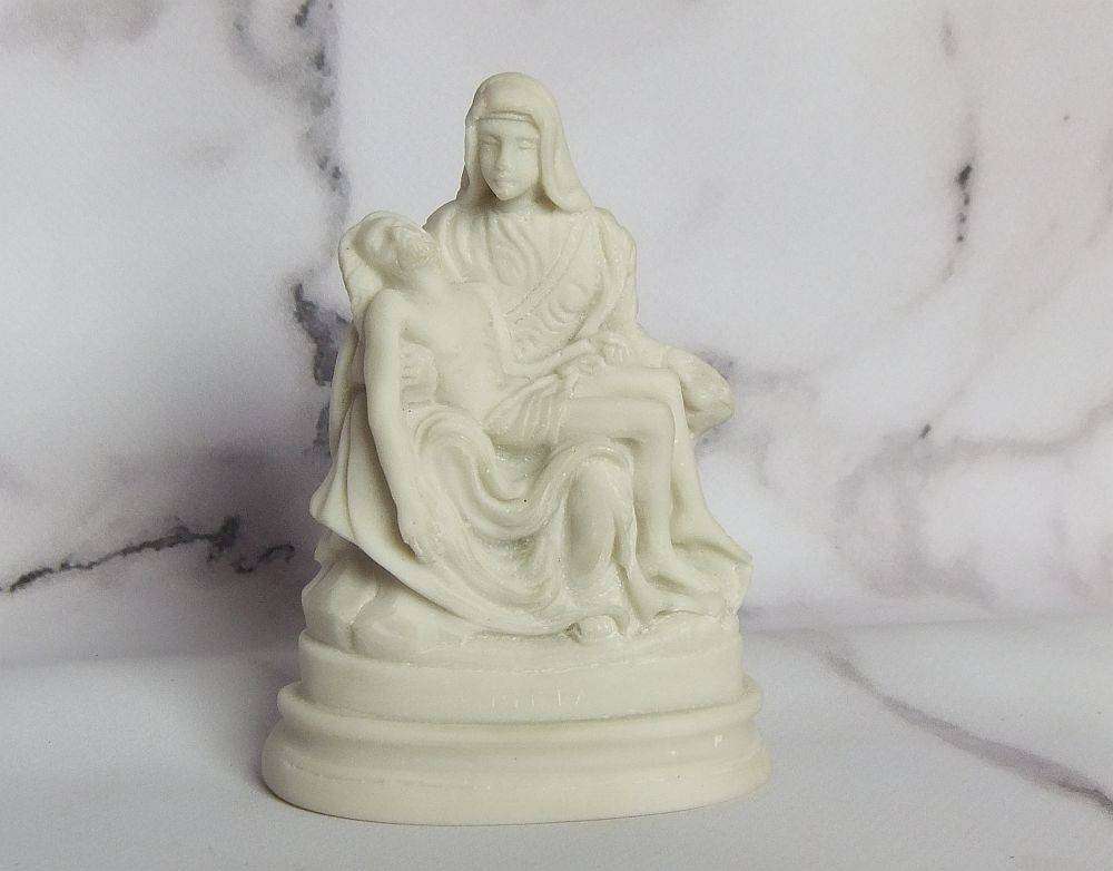 A vintage solid resin statuette of the Pieta by Michelangelo