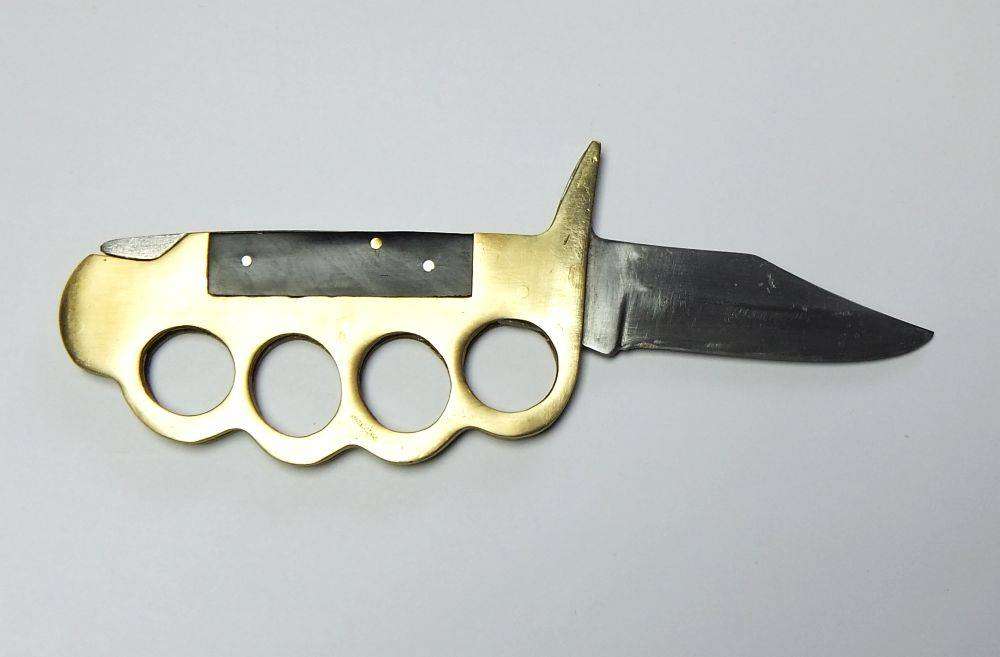 A rarely seen vintage brass knuckle duster knife combo in great working condition