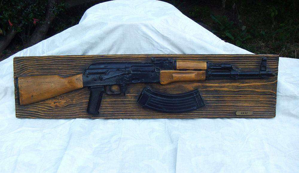 A rare vintage 1980`s hard foam wall mount demonstrational mold of an AK47 assault rifle