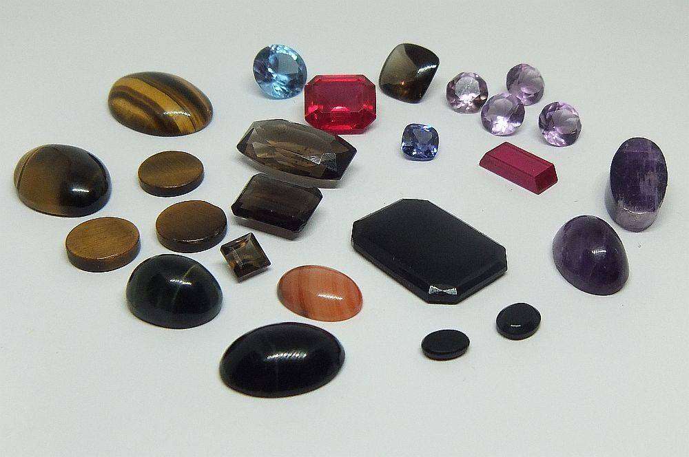 Various gorgeous cabochon and faceted stones removed from gold jewelry