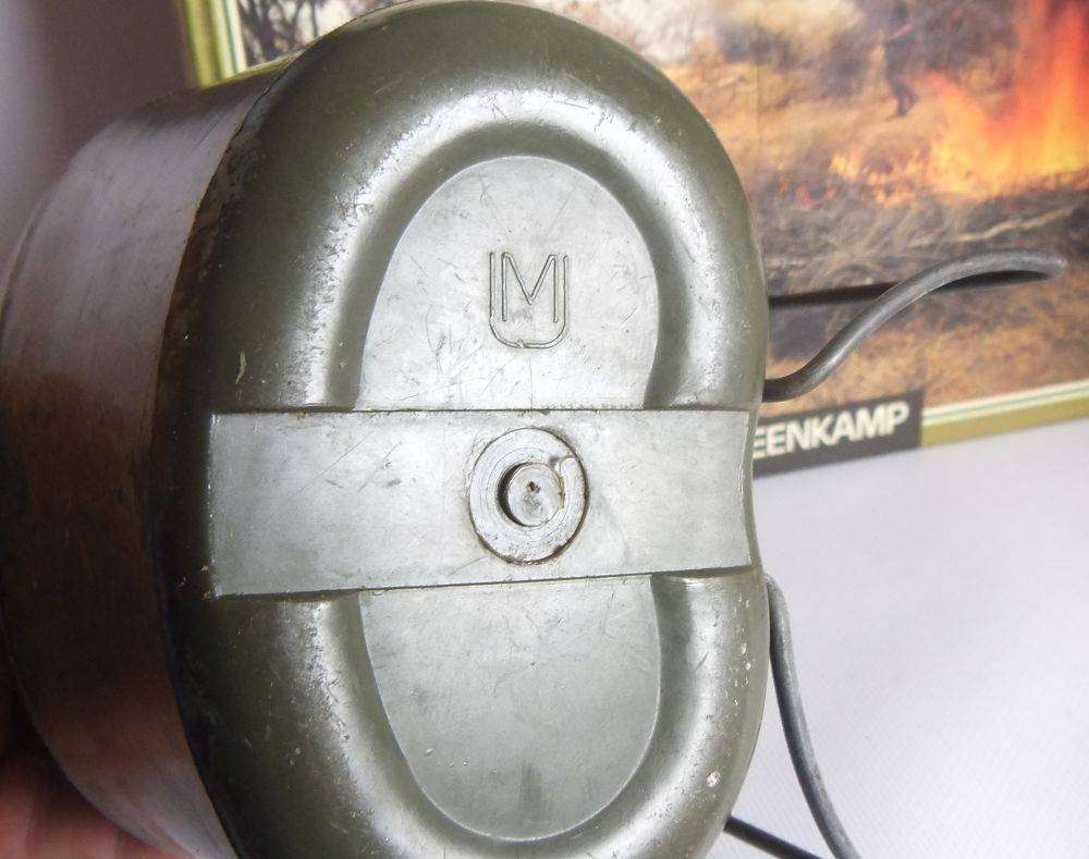 A vintage SA army helmet , water bottle and a book about the South African Border War