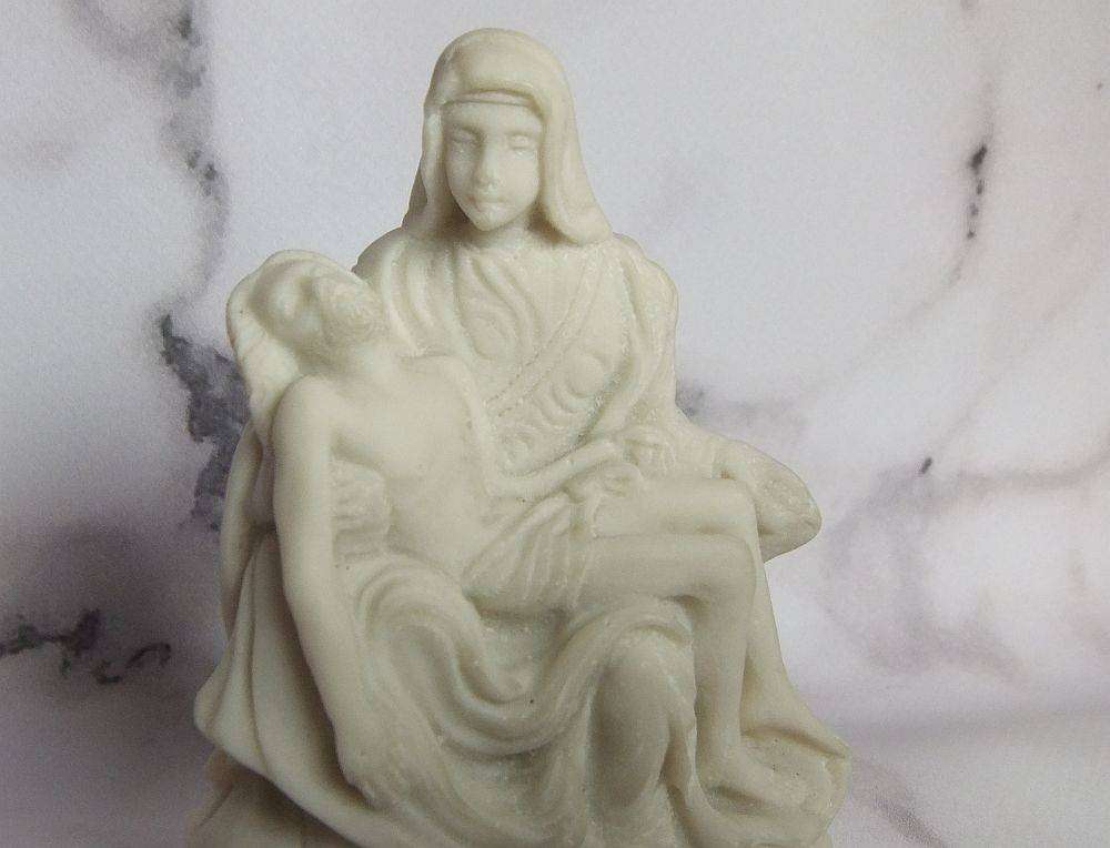 A vintage solid resin statuette of the Pieta by Michelangelo