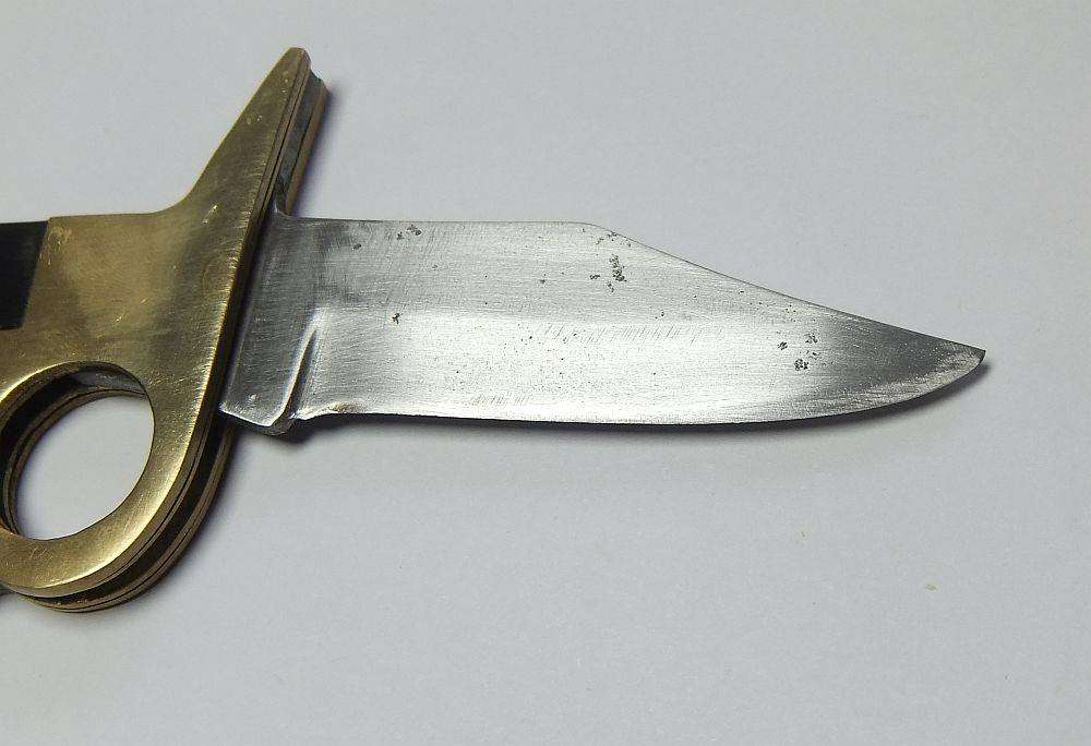 A rarely seen vintage brass knuckle duster knife combo in great working condition