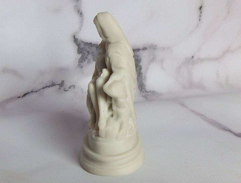 A vintage solid resin statuette of the Pieta by Michelangelo