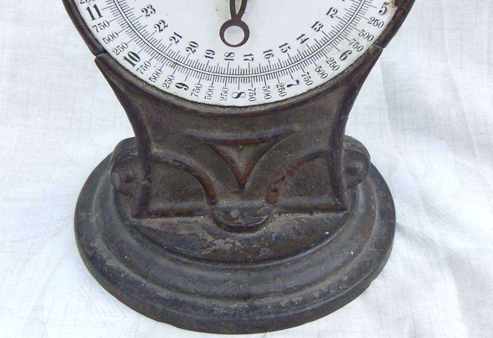 An amazing heavy antique cast iron scale with original weigh pan